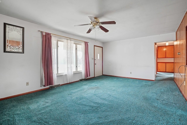 unfurnished living room featuring carpet floors and ceiling fan