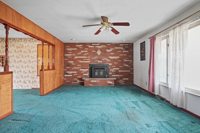 unfurnished living room featuring ceiling fan and carpet flooring