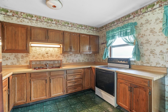 kitchen featuring electric stove and sink