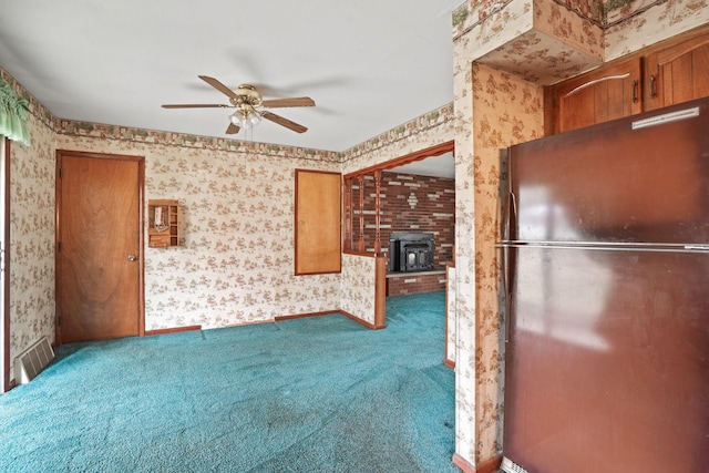 kitchen with fridge, ceiling fan, and carpet flooring