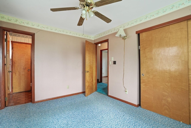 unfurnished bedroom featuring ceiling fan and carpet flooring