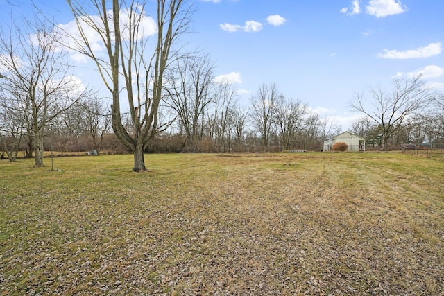 view of yard with a rural view