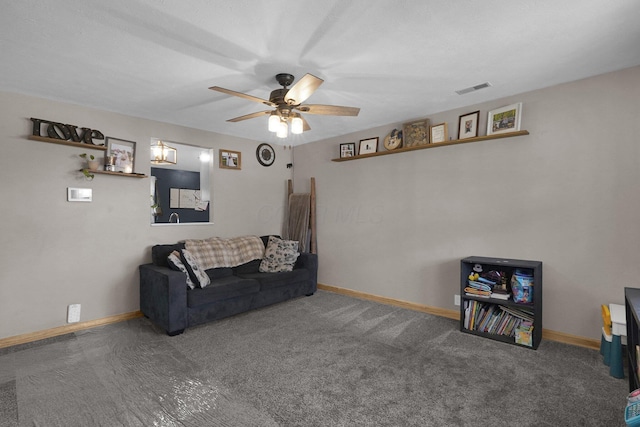 living room featuring ceiling fan and carpet