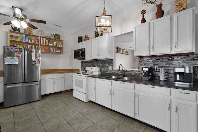 kitchen with appliances with stainless steel finishes, sink, and white cabinets