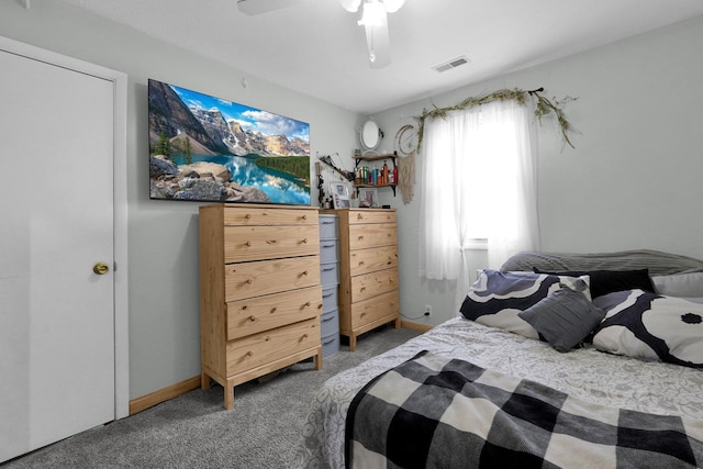 bedroom featuring ceiling fan and carpet