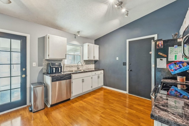 kitchen with white cabinetry, dishwasher, and sink