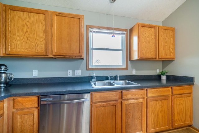 kitchen with sink, a textured ceiling, hanging light fixtures, and dishwasher