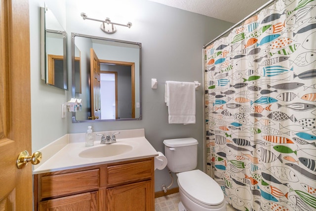 bathroom featuring vanity, a textured ceiling, toilet, and walk in shower