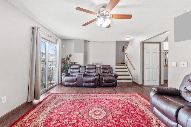 living room with hardwood / wood-style flooring and ceiling fan