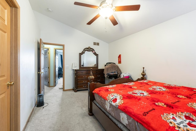 carpeted bedroom featuring lofted ceiling and ceiling fan