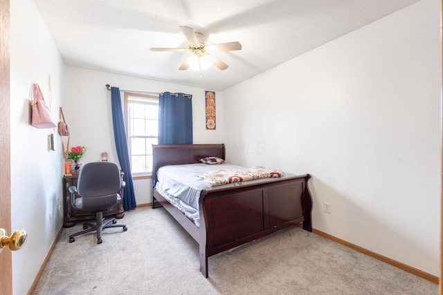 bedroom featuring light colored carpet and ceiling fan