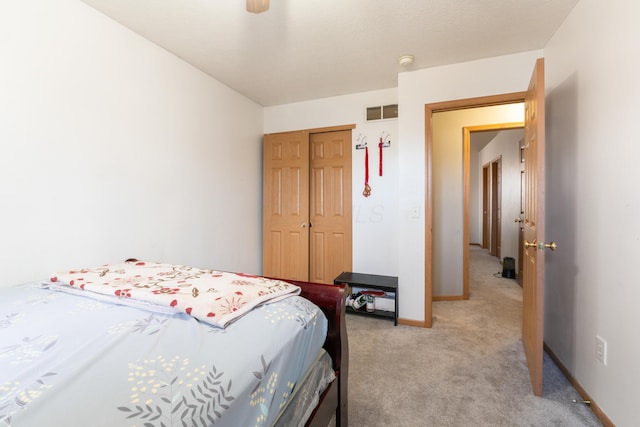 carpeted bedroom featuring ceiling fan