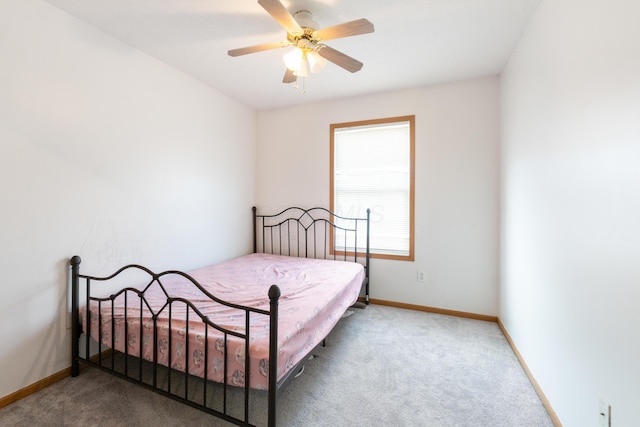 bedroom with ceiling fan and carpet