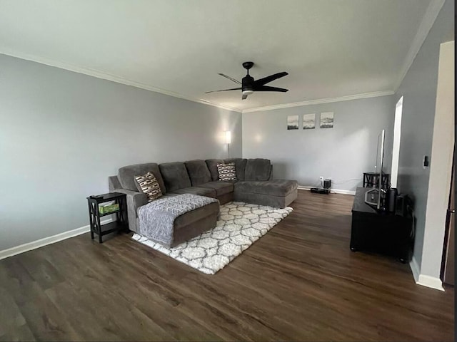 living room with dark wood-type flooring, ceiling fan, and ornamental molding