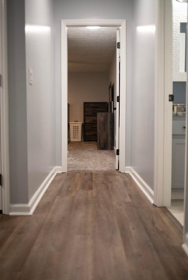 hallway featuring hardwood / wood-style flooring