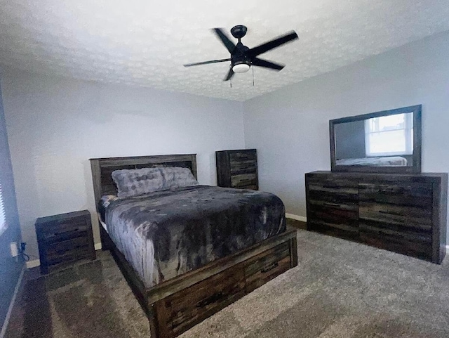 carpeted bedroom with ceiling fan and a textured ceiling