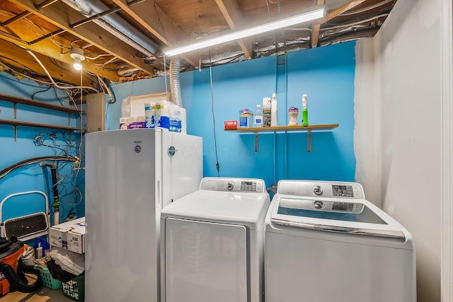 washroom featuring washer and dryer and laundry area