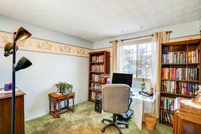 carpeted office space with a textured ceiling