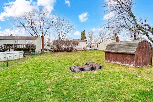 view of yard featuring a shed and a deck