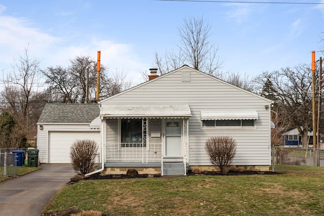 view of front of house with a garage and a front lawn