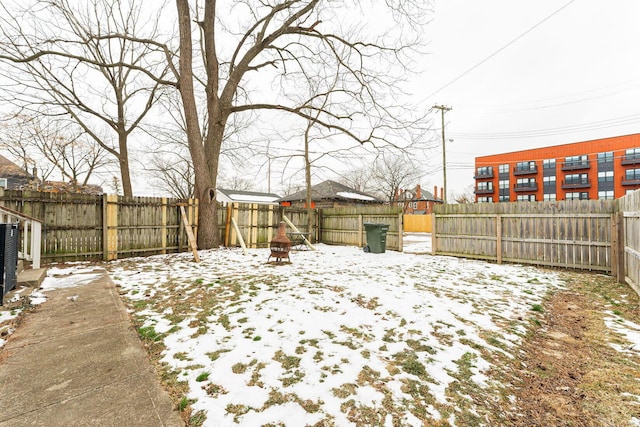 view of yard layered in snow