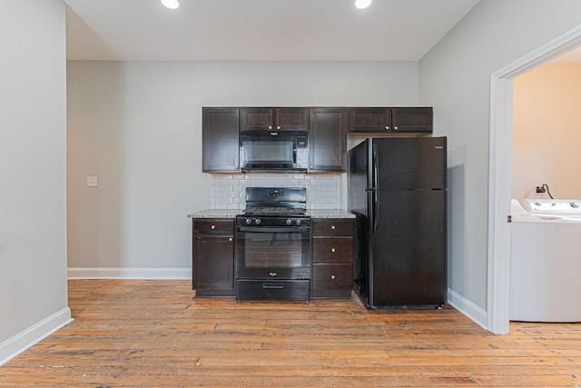 kitchen with dark brown cabinetry, decorative backsplash, black appliances, and light hardwood / wood-style floors