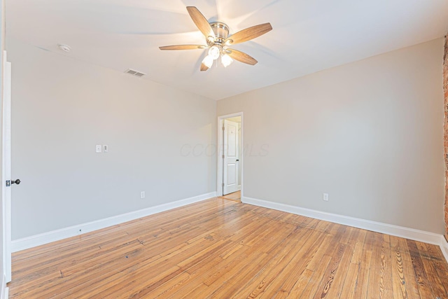 unfurnished room featuring ceiling fan and light hardwood / wood-style floors