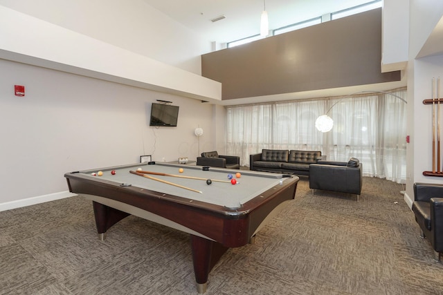 game room featuring dark carpet, pool table, and a towering ceiling