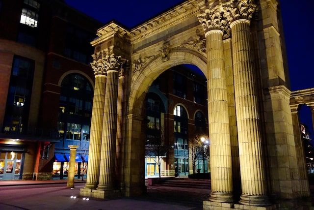 view of exterior entry at night