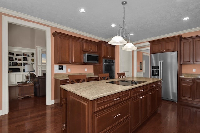 kitchen featuring appliances with stainless steel finishes, dark hardwood / wood-style flooring, a center island, and hanging light fixtures