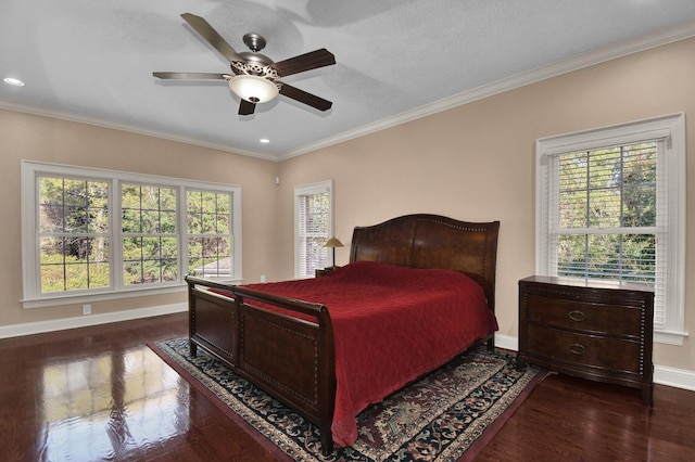 bedroom with multiple windows, dark wood-type flooring, and ornamental molding