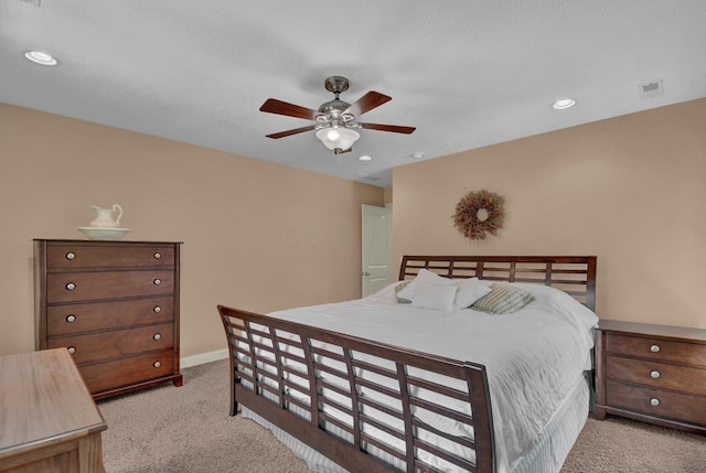 bedroom with light carpet and ceiling fan