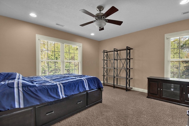 carpeted bedroom featuring ceiling fan