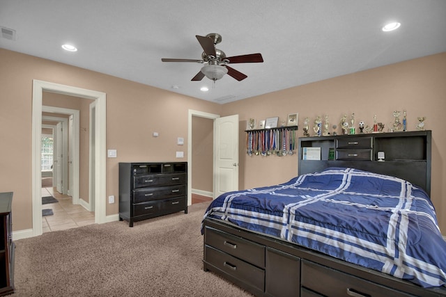 carpeted bedroom featuring ceiling fan