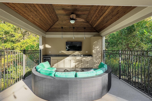 view of patio with wine cooler, ceiling fan, and outdoor lounge area