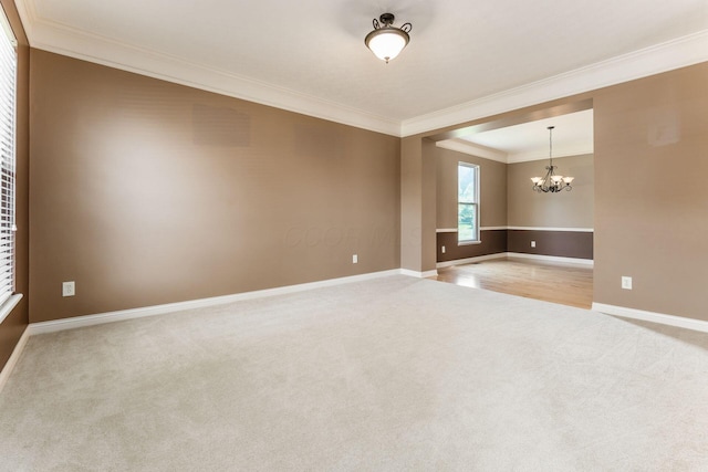 7873 Tullymore Dr, Dublin, OH 43016 - carpeted spare room featuring ornamental molding and a notable chandelier