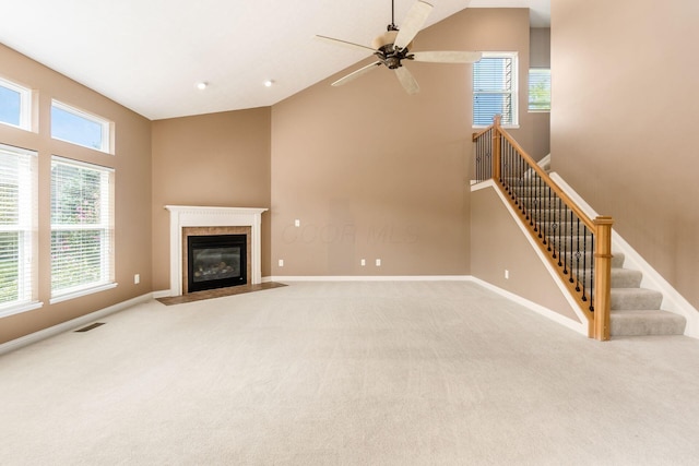 7873 Tullymore Dr, Dublin, OH 43016 - unfurnished living room featuring carpet floors, a fireplace, ceiling fan, and a high ceiling