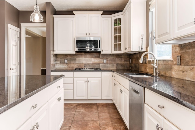 7873 Tullymore Dr, Dublin, OH 43016 - kitchen with pendant lighting, sink, white cabinets, and appliances with stainless steel finishes