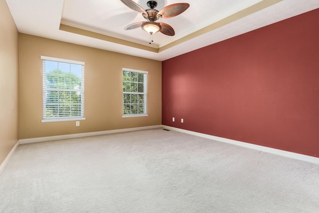 7873 Tullymore Dr, Dublin, OH 43016 - unfurnished room with ceiling fan, carpet flooring, ornamental molding, and a tray ceiling