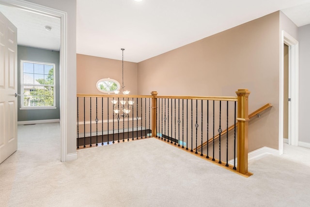 7873 Tullymore Dr, Dublin, OH 43016 - hallway with carpet floors and an inviting chandelier