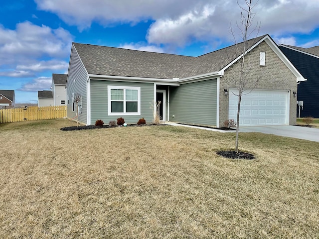 view of front of house with a garage and a front yard