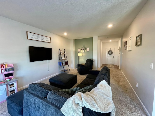 carpeted living room with a textured ceiling