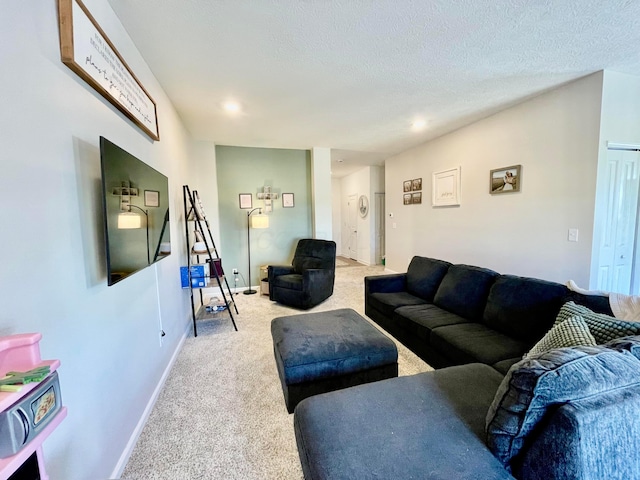 carpeted living room with a textured ceiling