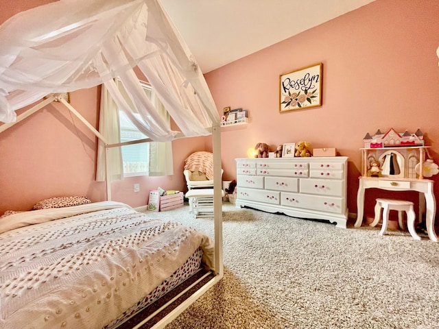 bedroom featuring vaulted ceiling and carpet floors