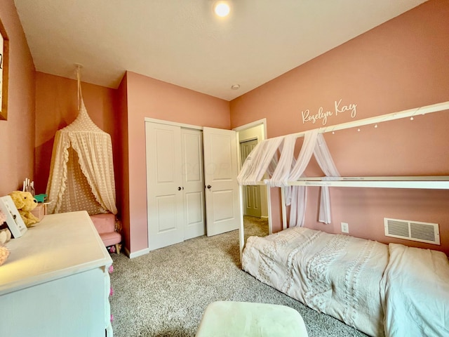 carpeted bedroom featuring a closet