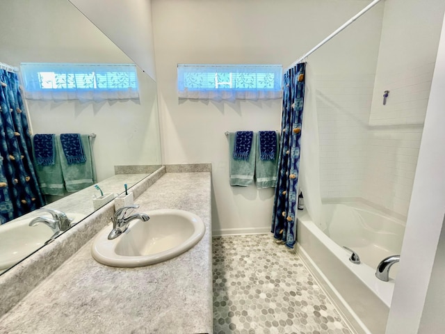 bathroom with vanity and shower / bath combo