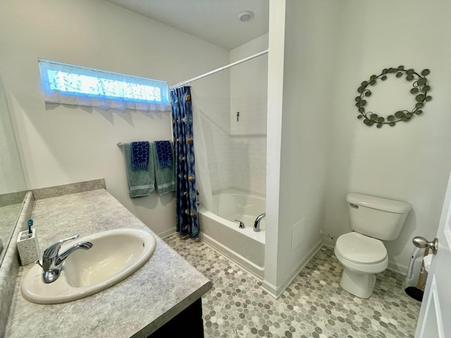 full bathroom featuring vanity, shower / tub combo with curtain, and toilet