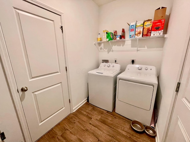 washroom featuring separate washer and dryer and hardwood / wood-style floors