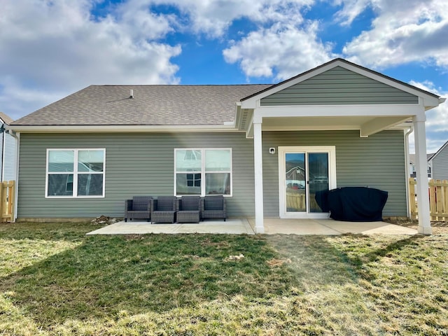 rear view of house featuring an outdoor hangout area, a lawn, and a patio