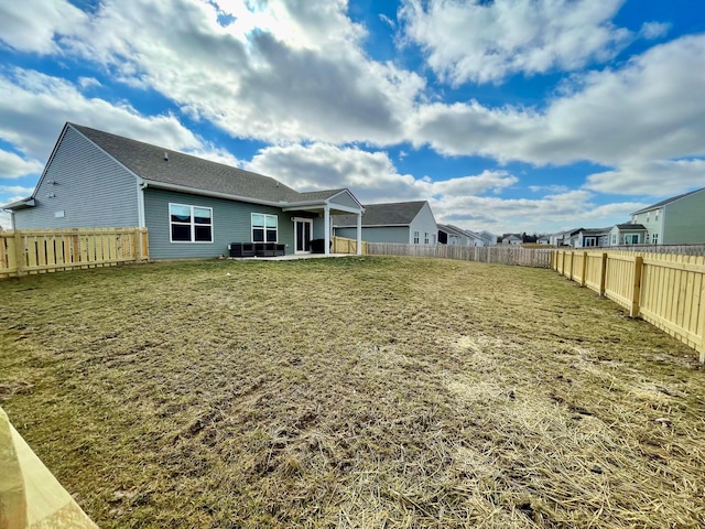 rear view of house with a lawn